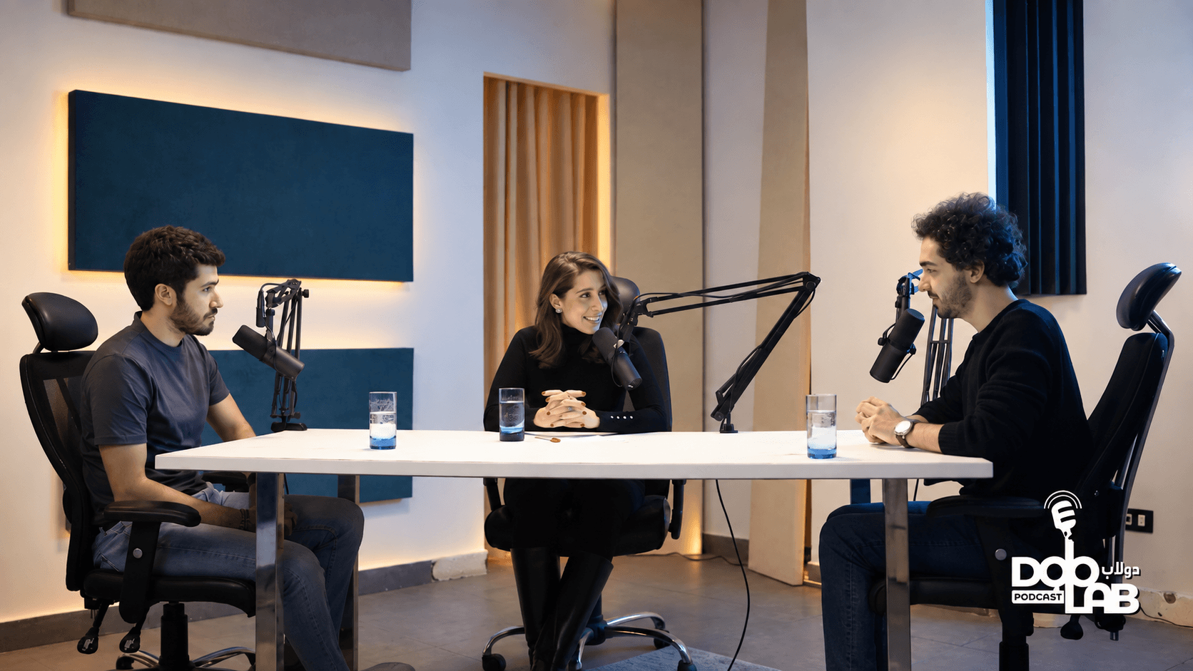 Doolab Podcast: three speakers recording around a table